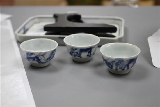 Six 19th century Chinese blue and white horses tea bowls and a later blue and white tray length 16cm